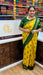 Heritage Sungudi Kolam saree in bright yellow with green zari border and geometric prints