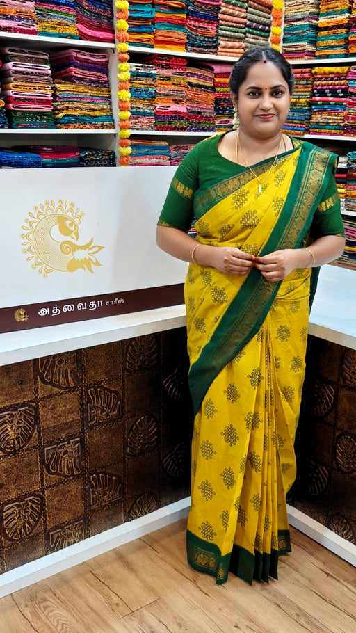Heritage Sungudi Kolam saree in bright yellow with green zari border and geometric prints