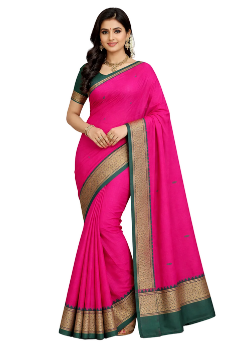 Woman wearing a pink saree with green and gold border on a white background