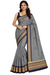 Woman wearing a gray saree with gold and navy border on a white